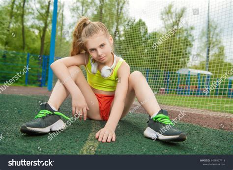 Girl in sports set slowly undresses and sits on the dick