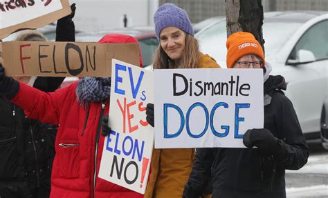 Rally at Tesla Motors Cleveland in Lyndhurst in protest of Elon Musk’s ...