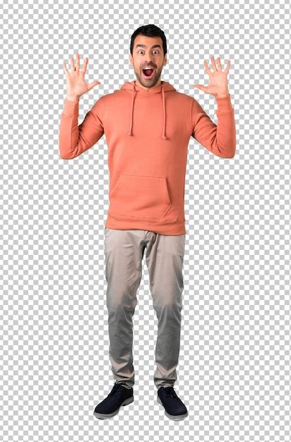 Man in a pink sweatshirt with surprise and shocked facial expression ...