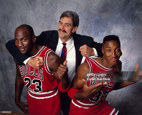 Closeup portrait of Chicago Bulls Phil Jackson hugging Michael Jordon ...