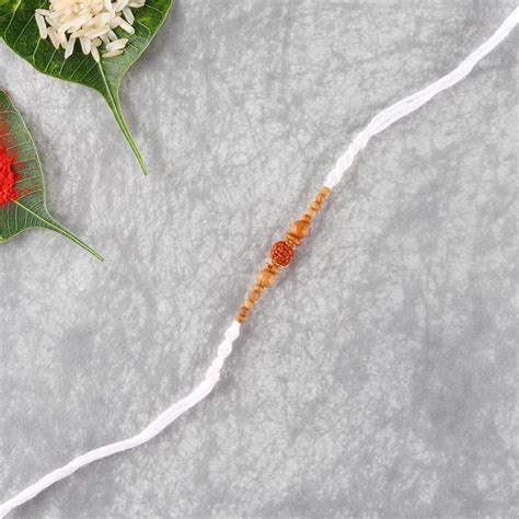 Send White Thread with Rudraksha Rakhi to Denmark Online - RKH22-105209 ...