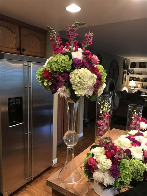Colorful tall centerpiece in trumpet vase Trumpet Vase Centerpiece ...