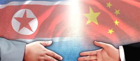 Seoul :flags of North Korea (L) and China