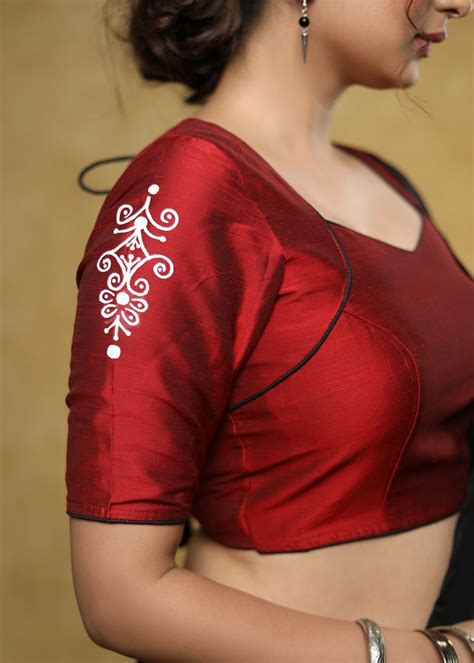 Graceful maroon cotton silk blouse with white hand painted motif on th ...