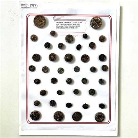 Lot Detail - Card of forty twinkle buttons.