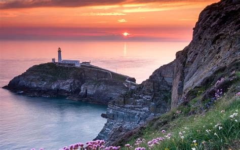 Download wallpaper rock, lighthouse, island, Wales, South Stack ...