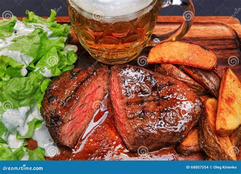 Beef Steak with French Fries and Beer Stock Photo - Image of bone ...