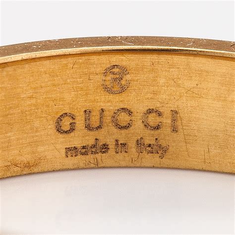 Gucci, An 18K gold ring "Icon". Marked Gucci, Made in Italy, 13 ...