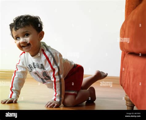 Baby crawling on the floor Stock Photo - Alamy