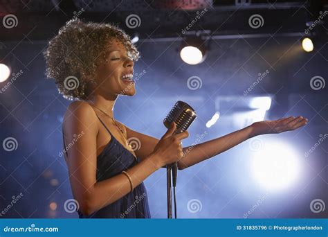 Female Jazz Singer on Stage Stock Photo - Image of microphone ...