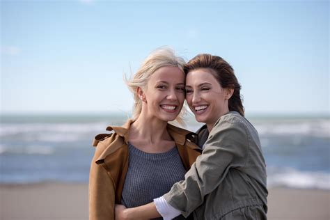 Women Smiling And Enjoying Life at Beach 12640643 Stock Photo at Vecteezy