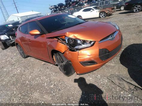 Report KMHTC6AD7FU235940 HYUNDAI VELOSTER 2015 Orange Gasoline - price and damage history