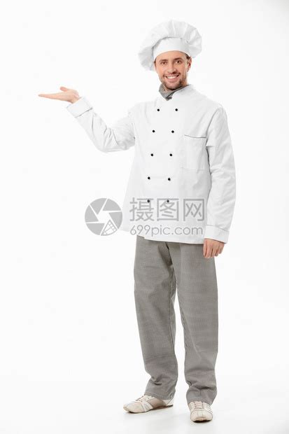 年轻男厨师手持灰色背高清图片下载-正版图片503859341-摄图网