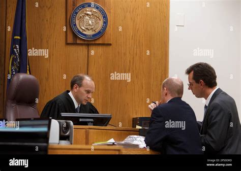 Judge Derek Pullan confers with Utah County Prosecutor Chad Grunader ...