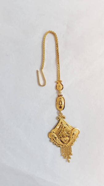 What is called Maang Tikka in English?