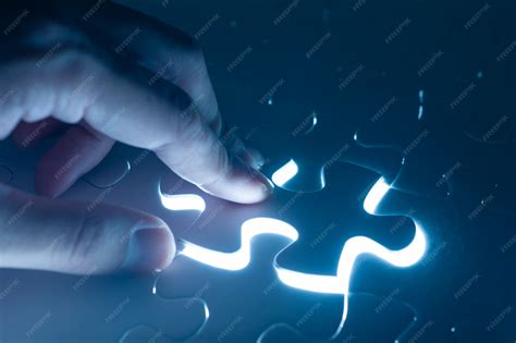 Hand insert jigsaw, conceptual image of business strategy | Premium Photo