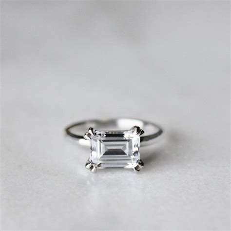 emerald cut diamond ring east west