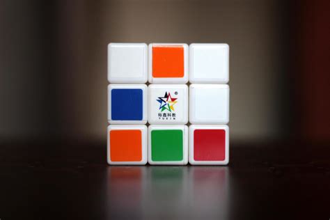 Rubik's cube on the black background. Rubik's Cube was invented by Hungarian architect Erno ...