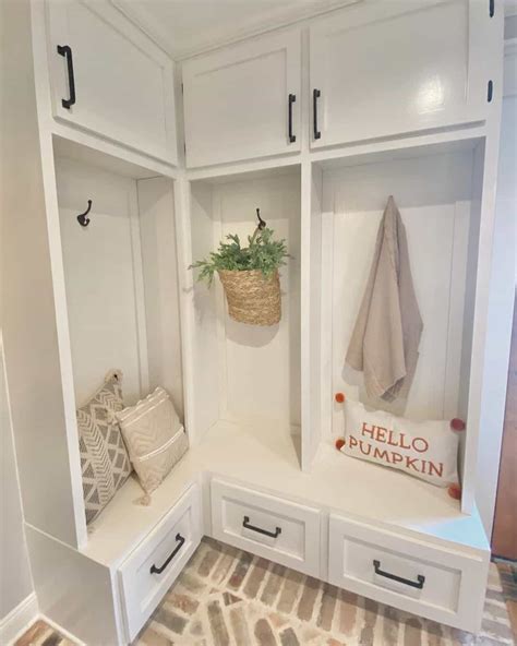 Charming White Mudroom With Natural Brick Flooring - Soul & Lane