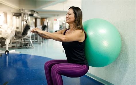 Image result for Squats Using Exercise Ball