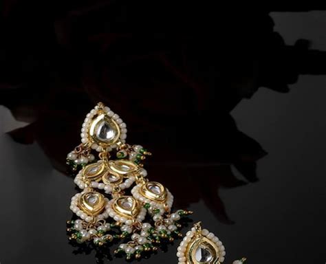 Gold Toned Handcrafted Metal Kundan Earrings