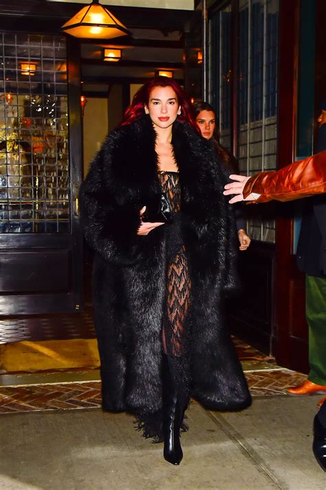 Dua Lipa pairs a massive fur coat with a barely-there dress | Vogue India