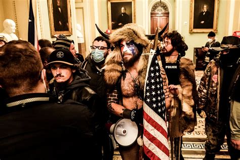 Capitol Rioter Known as QAnon Shaman Pleads Guilty - The New York Times