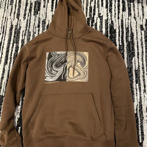 Brown hoodie with a nice artistic design in the middle - Depop