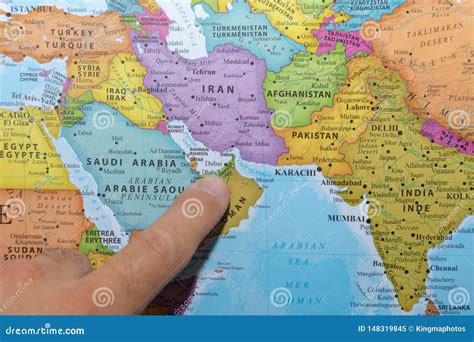 Finger Pointing To a Colorful Country Map of the United Arab Emirates ...