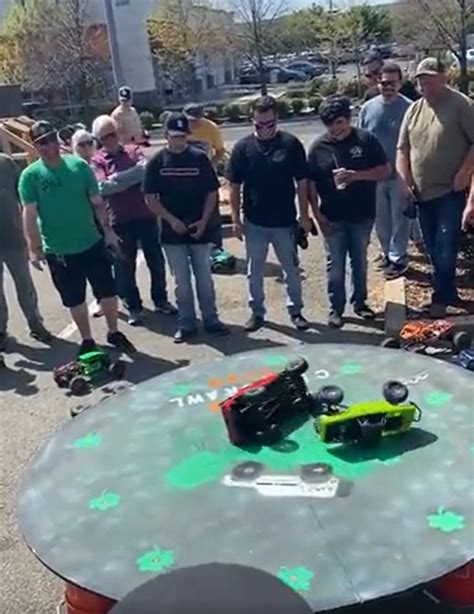 Group Of Men Battling It Out With Remote-controlled Cars