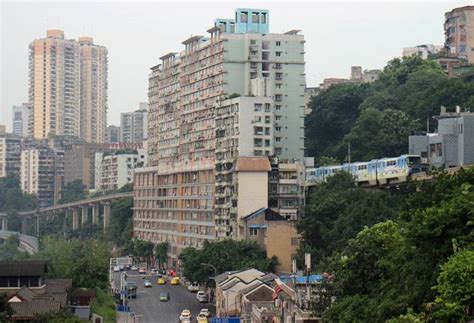 Watch: This train runs through a building in China's Mountain City ...