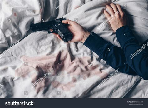 Pistol On Bed