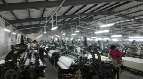 纺织厂上轴技巧,织布厂上轴工要学多久,纺织厂上轴工_大山谷图库