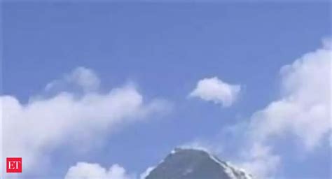 Spacewalker Mikhail prepares to hit ball - | The Economic Times