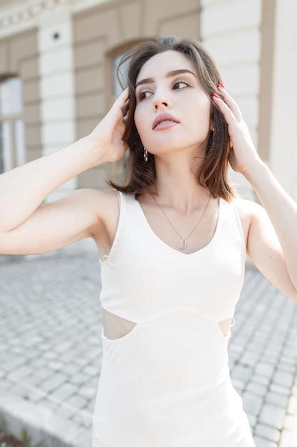 Fashionable beautiful stylish model girl with a short haircut in a ...