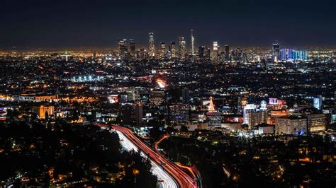 Download wallpaper 1366x768 night city, buildings, aerial view ...