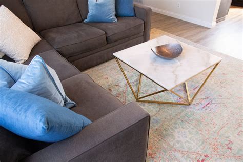 Free Stock Photo of Living Area With Sectional Sofa And Coffee Table