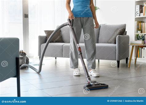 Woman Vacuuming the Floor at Home Stock Photo - Image of cleaner ...