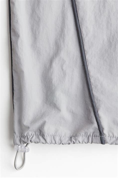 Piping-detail track pants - Light grey - Ladies | H&M IN