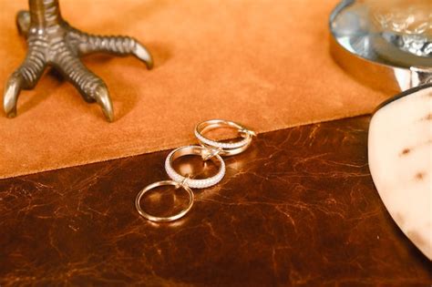 A statue of a hand with a ring on it sits next to a statue of a hand ...