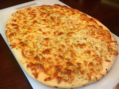 White pizza with garlic, olive oil, oregano, mozzarella and provolone ...