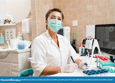 Laboratory Assistant Holds Test Tubes for Gynecological and Cytological Analysis. Woman ...