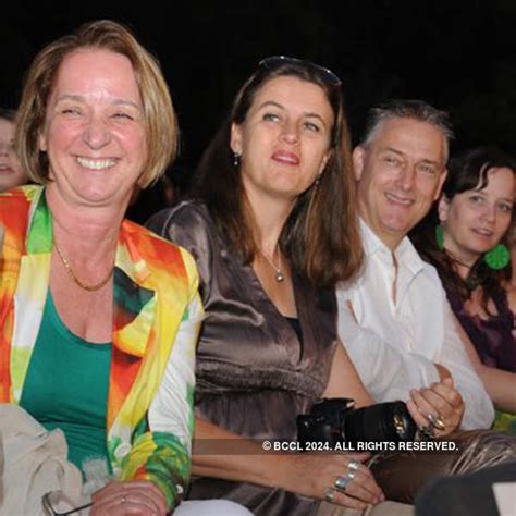 Guests enjoy themselves during a charity fashion show, held at ...