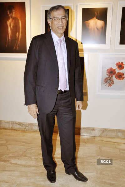 Niranjan Hiranandani smiles into the camera during a photo exhibition ...