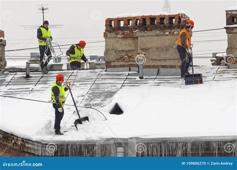 Roof cleaning from snow editorial image. Image of cleaning - 109806270