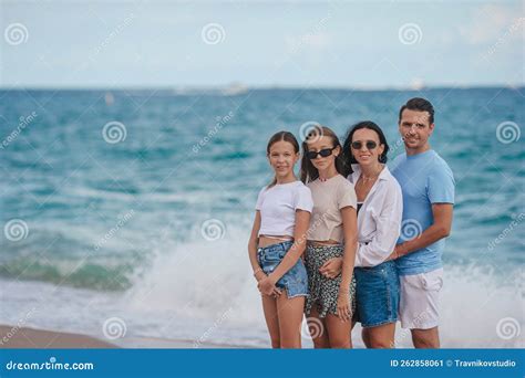 Happy Family Posing on the Beach during Summer Vacation Stock Image ...