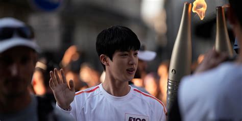 Who is carrying the Olympic torch through Paris? A BTS star, a garbage ...