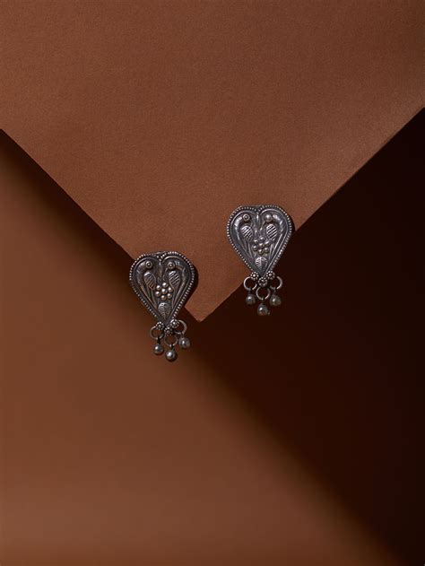 Silver-toned handcrafted brass accessories to shop online from the Loom