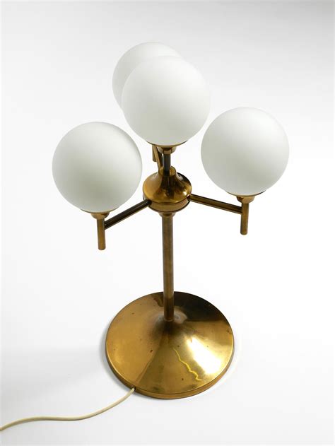 Large 1960s brass table or floor lamp with 4 glass spheres by Kaiser ...