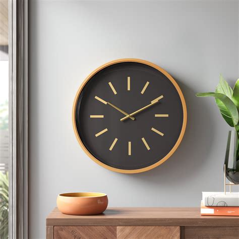 Wade Logan® Black Metal Decorative Wall Clock with Gold Accents, 24" x ...